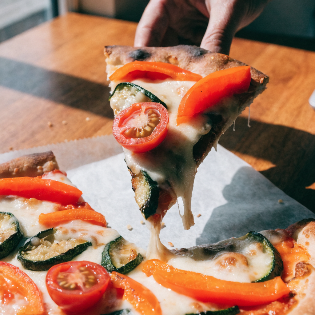 Close-up of crisp crust roasted vegetable pizza